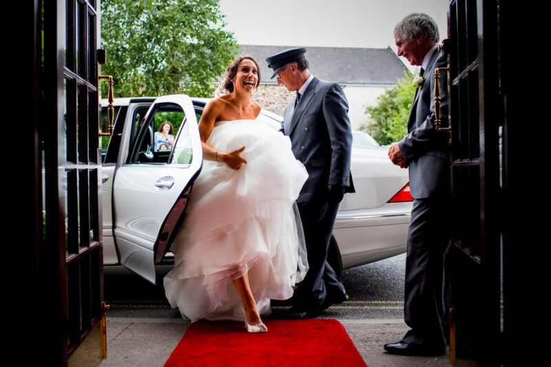 Bridebook.co.uk- bride stepping out of wedding car