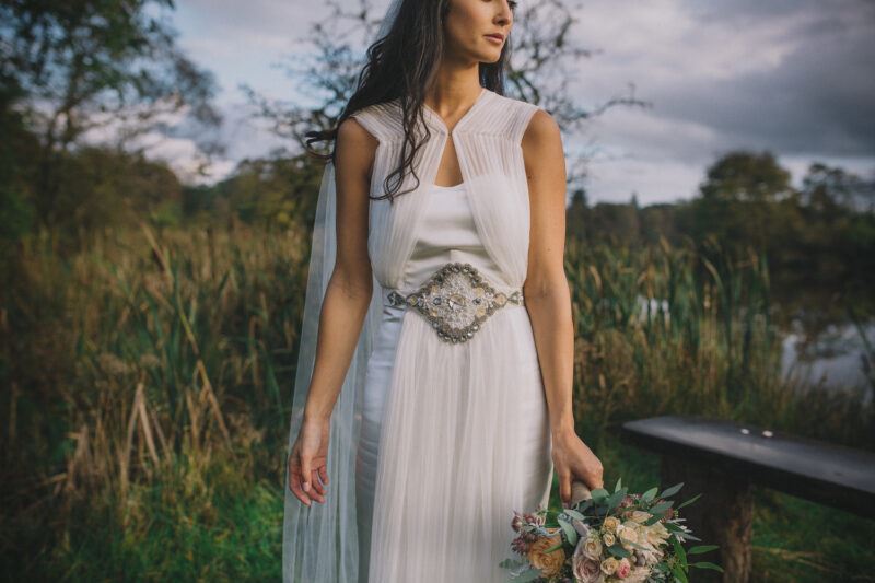 Bridebook.co.uk- bride in her wedding dress with belt embellishment 
