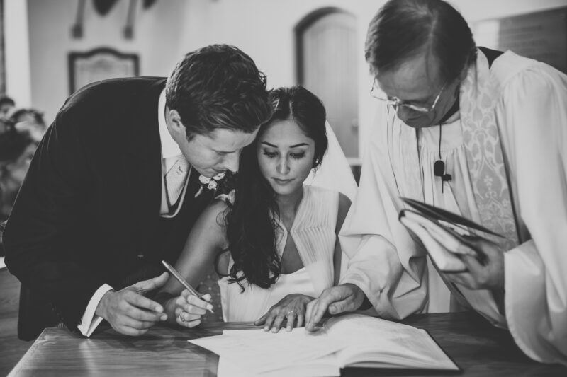 Bridebook.co.uk- bride signing the register