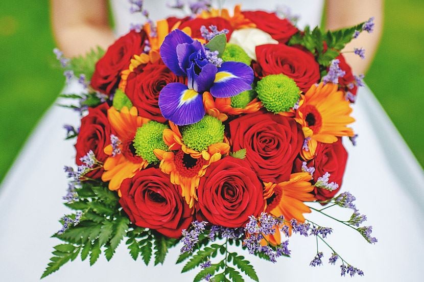 Bridebook.co.uk- red roses and bright flowers bridal bouquet