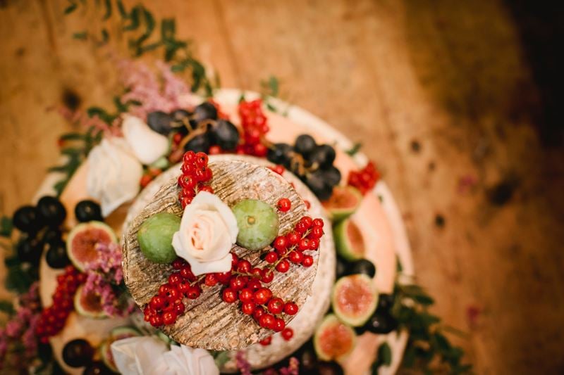 Bridebook.co.uk- cheese wedding cake decorated with berries