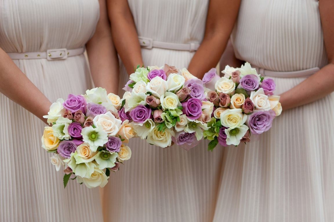 Bridebook.co.uk- bridesmaids holding up their wedding bouquets
