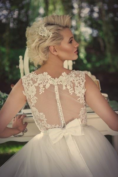Bridebook.co.uk- bridal gown with sheer back and bow