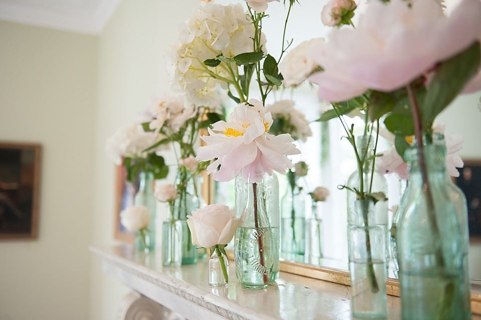 Bridebook.co.uk- wedding flowers on mantelpiece 