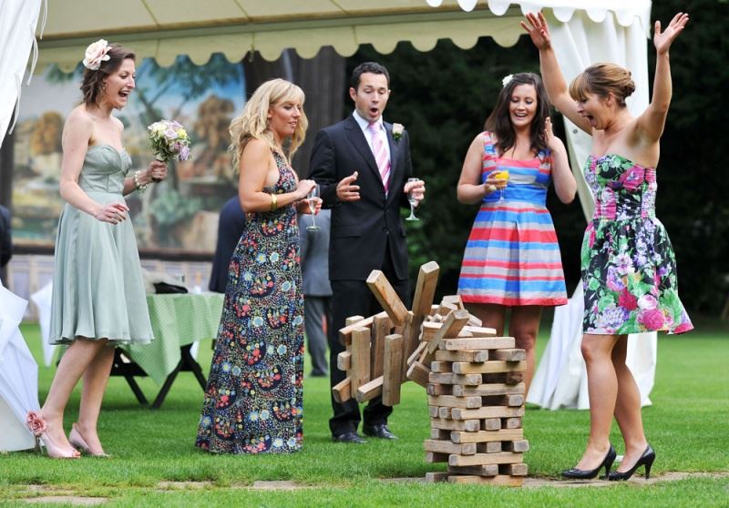 Bridebook.co.uk-  guests playing giant jenga on the lawn