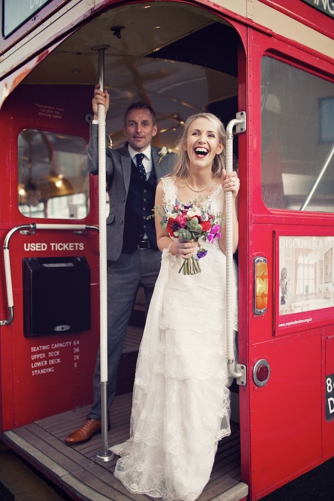 Bridebook.co.uk- bride and groom on board a red london bus