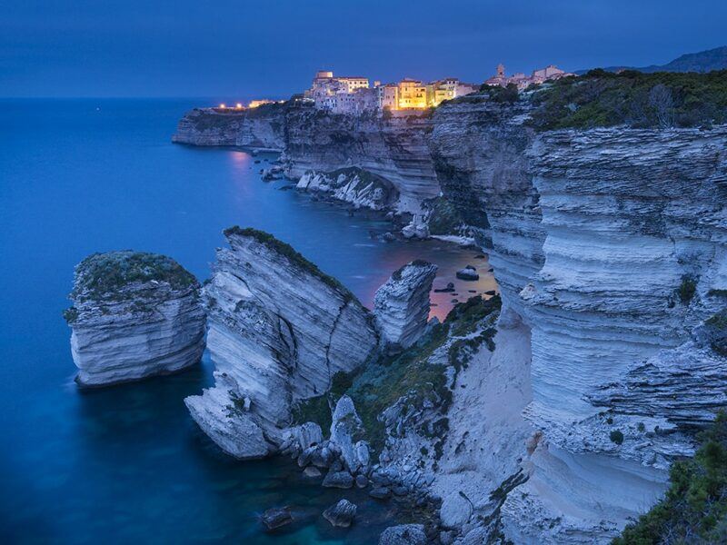 Bridebook.co.uk- seaside town on a cliff at night