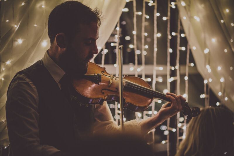 Bridebook.co.uk - violin player entertaining