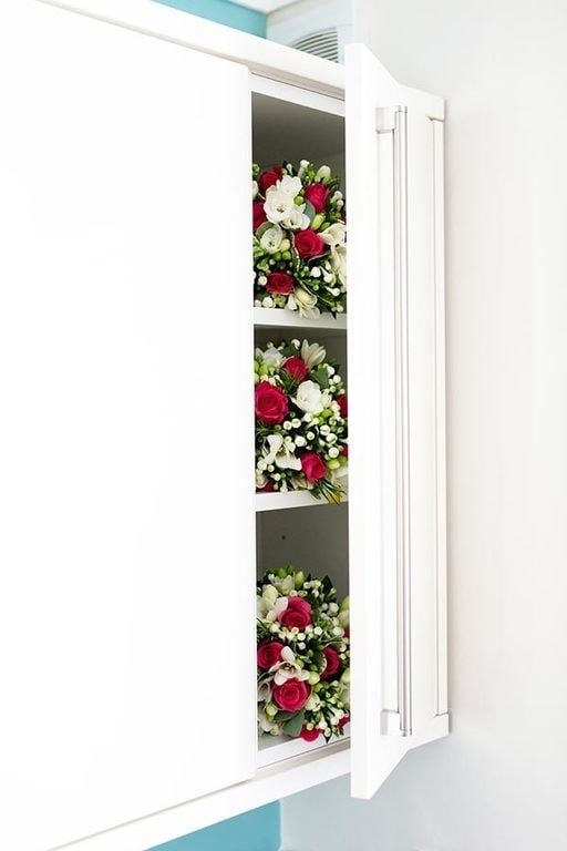 Bridebook.co.uk- wedding bouquets in cupboard