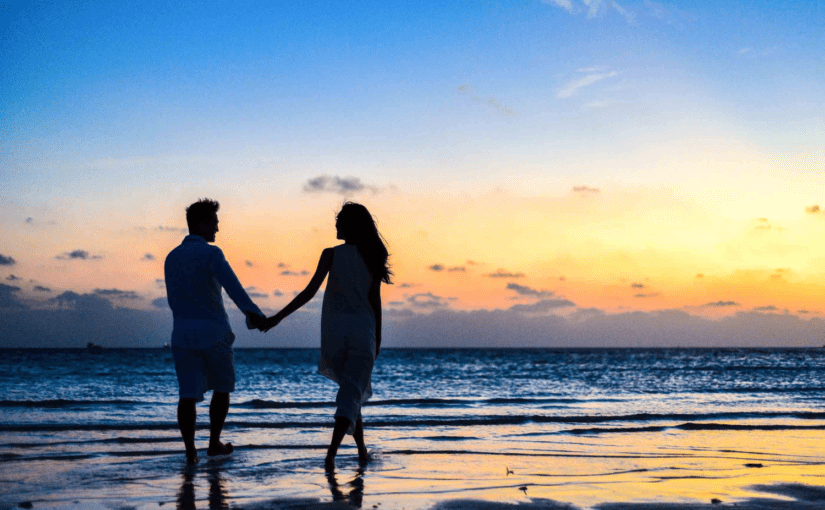 Couple on a romantic beach honeymoon