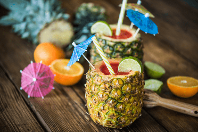 Pineapple juice with colourful party hats