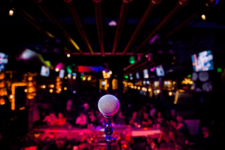 Comedy club night with microphone and live audience