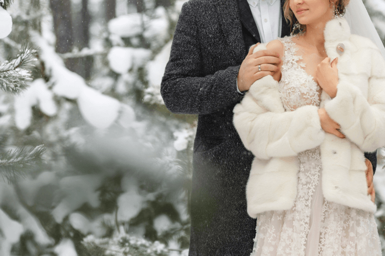 Bride and groom in a snowy wintry setting