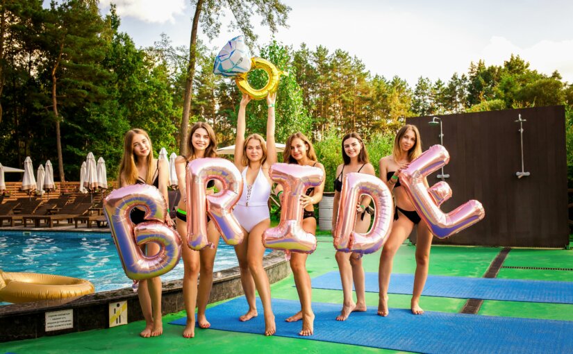 6 woman holding BRIDE baloons