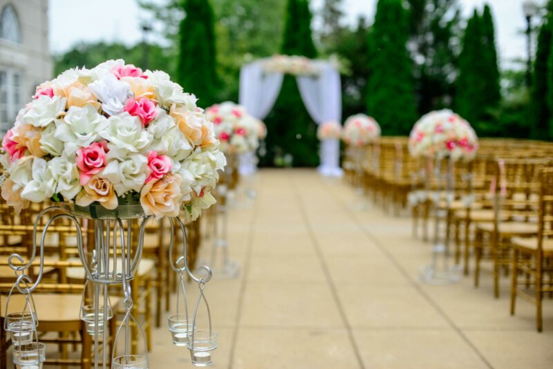 Flowers along a wedding aisle