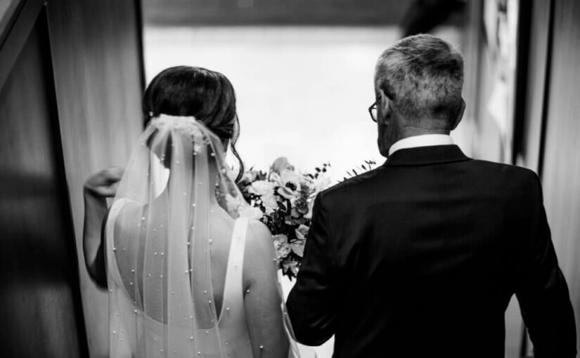 Father of the bride walking her down the aisle