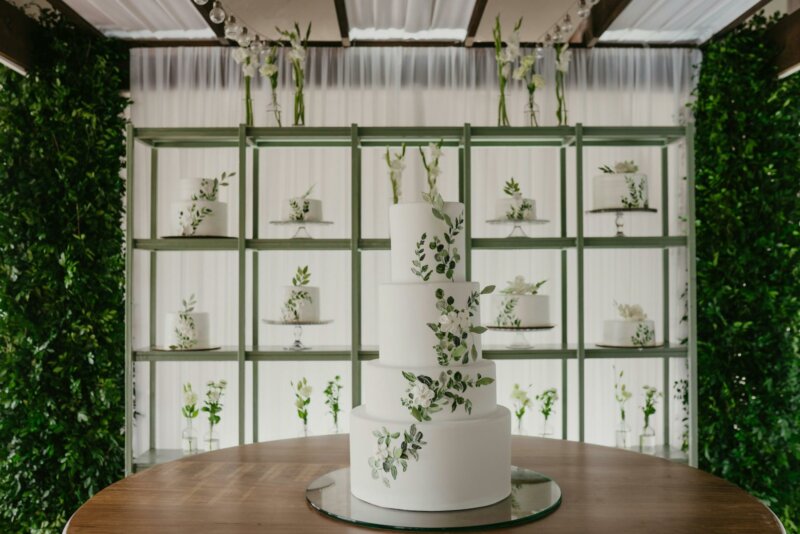 Big white wedding cake with natural decorations