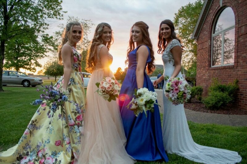 Bride and bridesmaid with flower bouquets