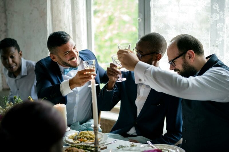 Friends cheering at an engagement pary