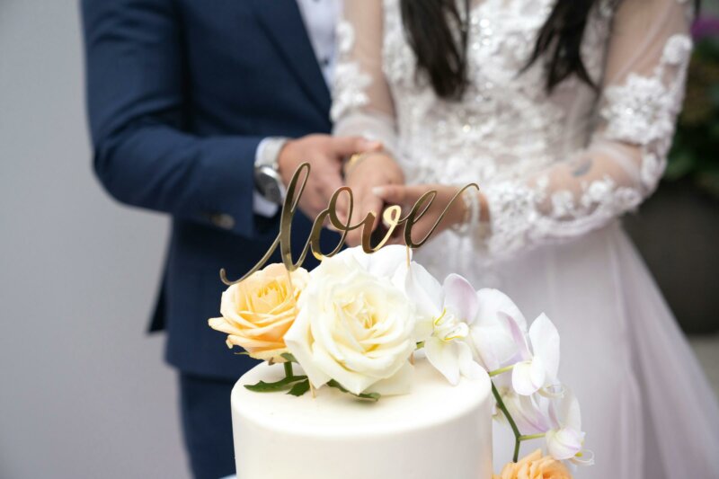 Love and roses topper on a wedding cake