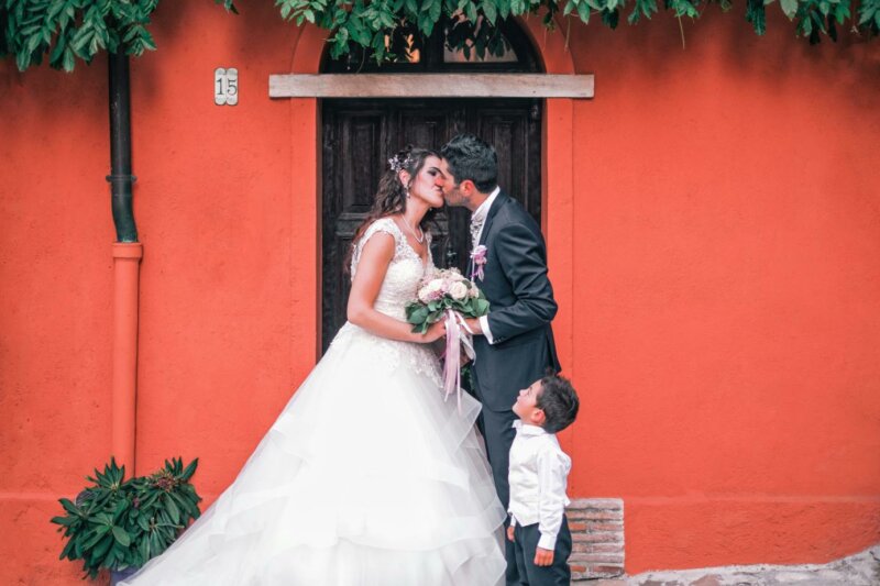 Page boy with couple at a wedding