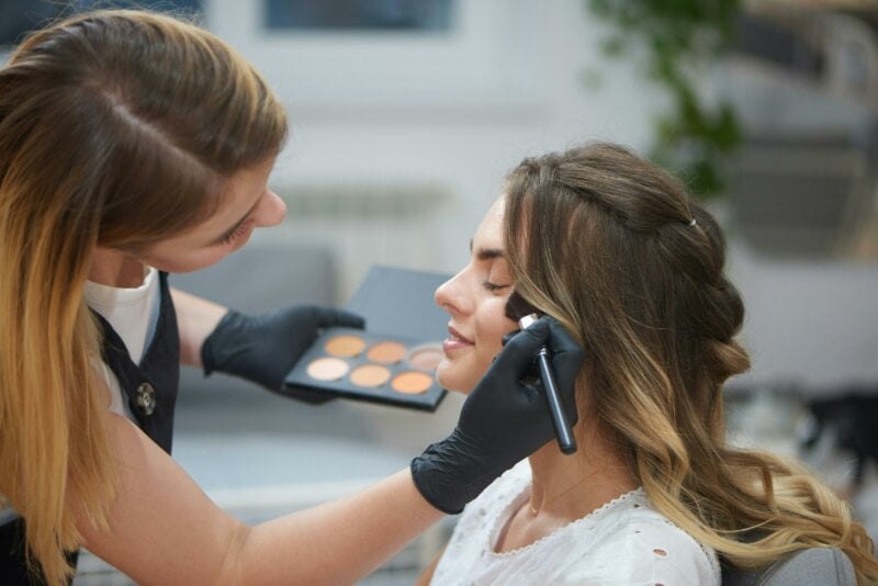 Bride getting her make up done