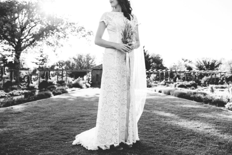 Bride holding a bouquet in black and white