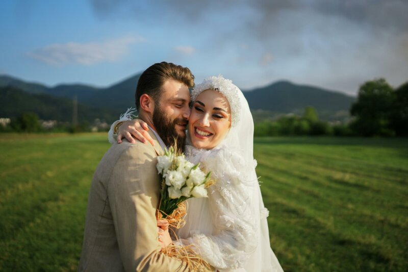 Smiling Muslim couple at their wedding