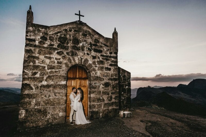 Couple in front of a small church outside