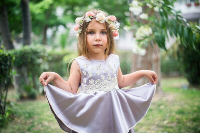 Flower girl showing her dress