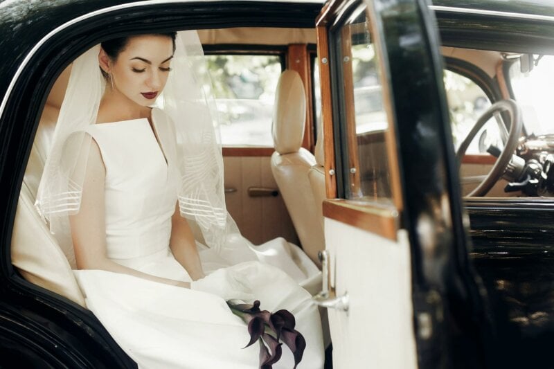 Bride getting off a car