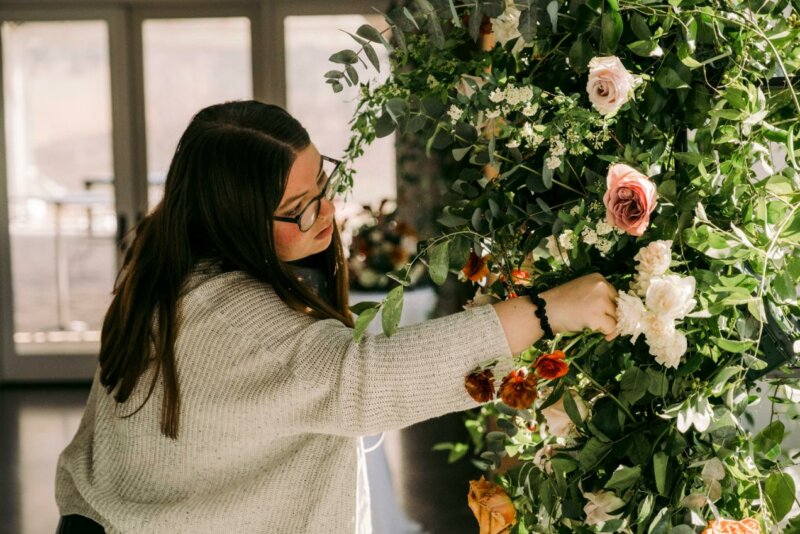 Woman arranging wedding flowers