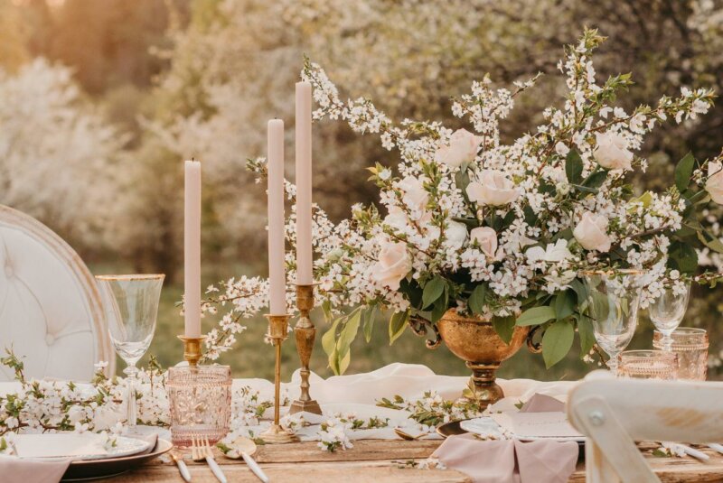 Wedding table with candles and white flowers