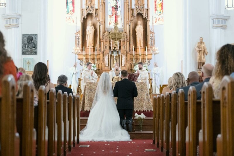 Back of a couple getting married in a church