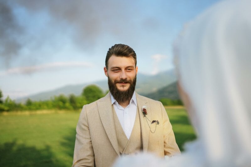 Muslim groom looking at his bride