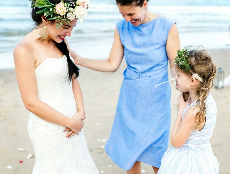 Bride smiling at her flower girl