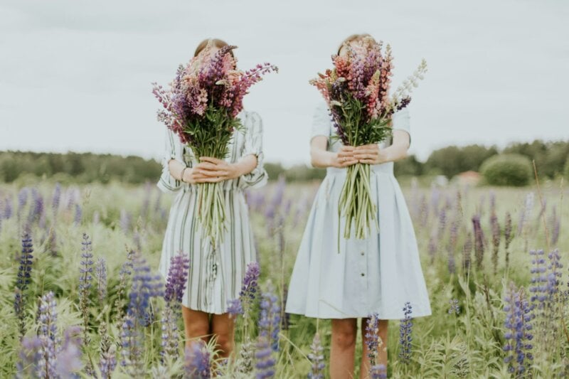 Two girls with big flower bouquets