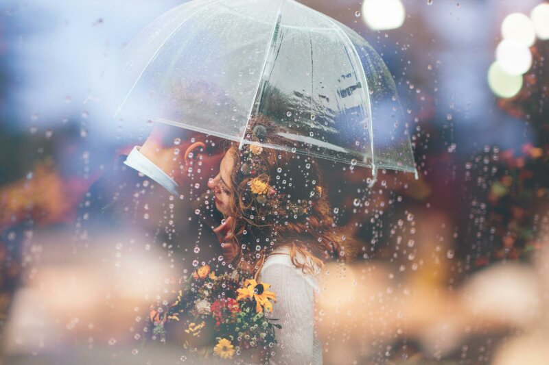 Married couple under an umbrella