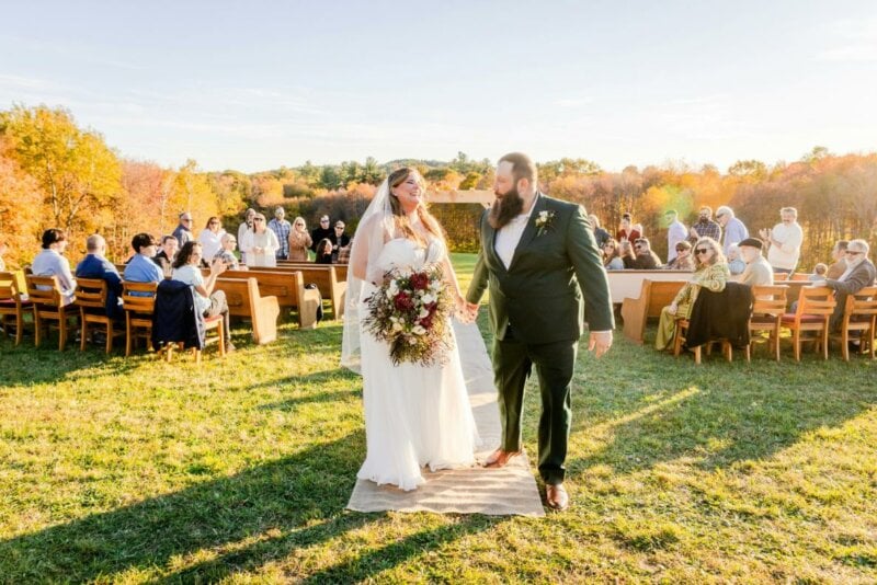 Married couple walking in a field