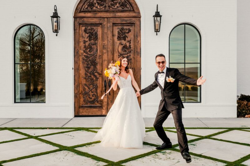 Married couple in front of a wooden door