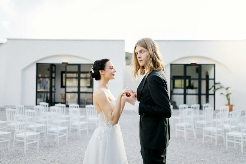 Married couple holding hands