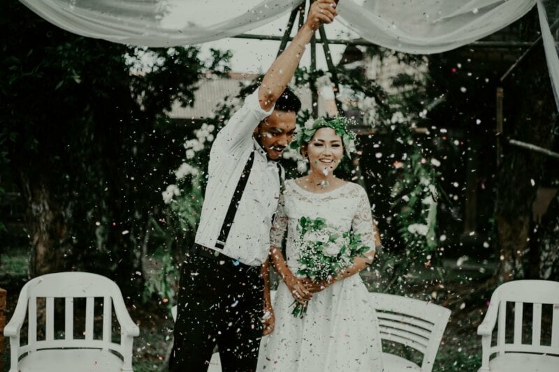 Married couple with flower petals