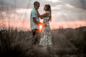 Couple getting engaged at sunset