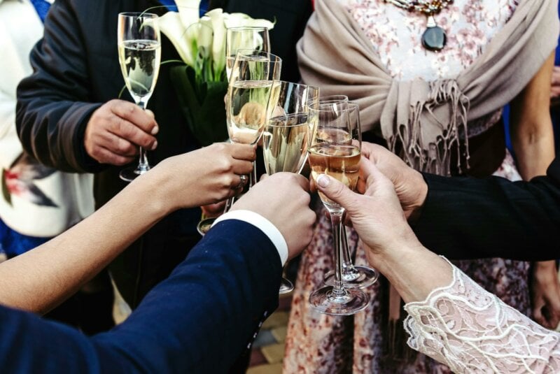 Guest toasting with Champagne