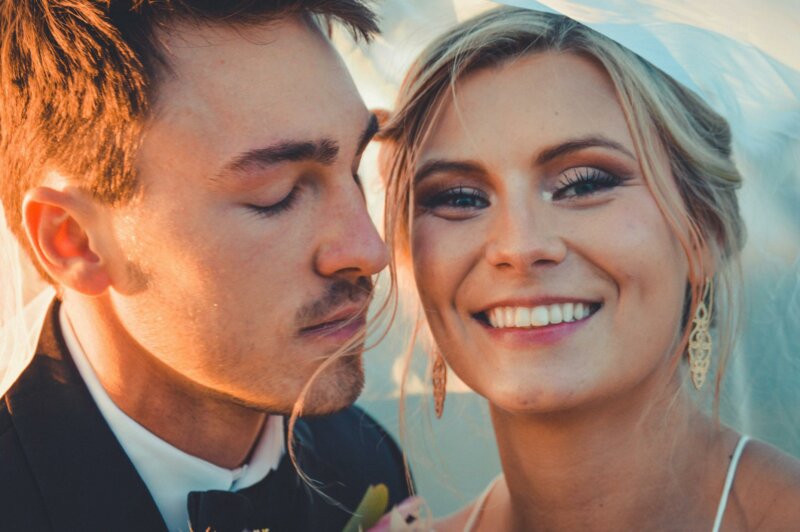 Smiling bride with groom