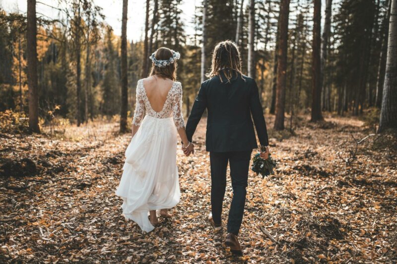Married couple walking in a forest