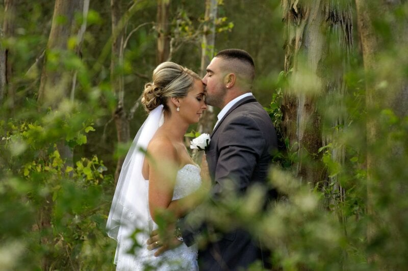 Kissing couple in a forest