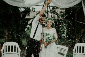 Married couple with flowers petals