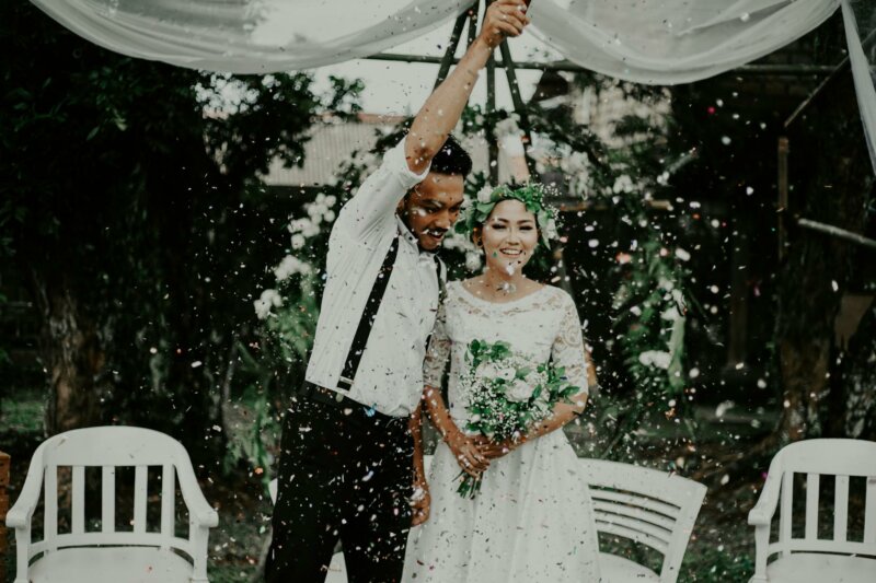 Married couple with flowers petals