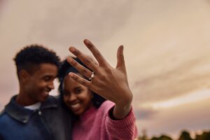 Engaged couple showing hand